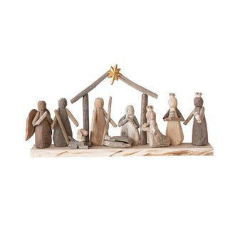 Wooden nativity scene with figures and stable on a white background