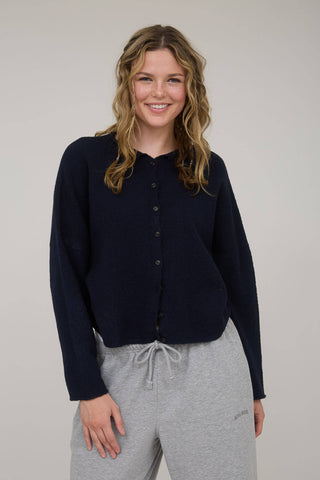 LARGE ROUND NECKLINE BUTTON DOWN LONG SLEEVES SEAMLESS DETAIL LIGHT WEIGHT KNIT CARDIGAN WOOL BLEND.