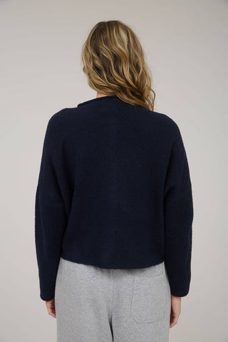 LARGE ROUND NECKLINE BUTTON DOWN LONG SLEEVES SEAMLESS DETAIL LIGHT WEIGHT KNIT CARDIGAN WOOL BLEND.