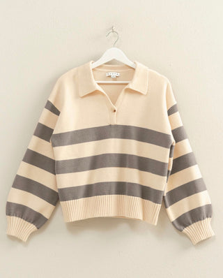Grey and cream striped knit sweater with front button closure, collar, and cuffed sleeves. Vibrant and Cozy. 