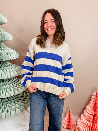 Cobalt Blue and cream striped knit sweater with front button closure, collar, and cuffed sleeves. Vibrant and Cozy. 