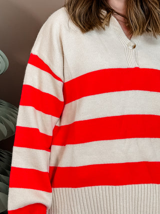Red and cream striped knit sweater with front button closure, collar, and cuffed sleeves. Vibrant and Cozy. 