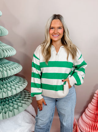 Green and cream striped knit sweater with front button closure, collar, and cuffed sleeves. Vibrant and Cozy. 