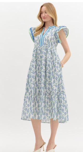 Floral print multicolor accented V-neck band pullover midi dress. Flutter sleeve featuring contrast accented binding finish. Pockets at sides. Lined. Woven. Non-sheer. Lightweight.