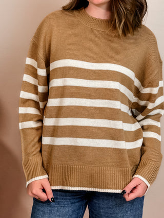 Taupe sweater with cream stripes, crew neckline, and easygoing fit. 