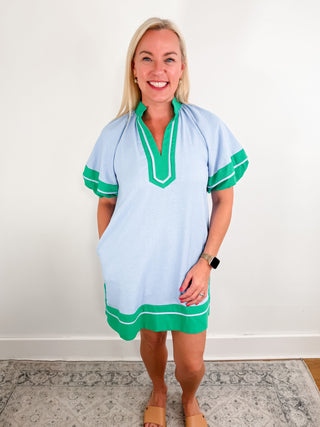 Solid contrast accented short lantern sleeves pullover mini dress with slit hem featuring a high neck split collar band.
