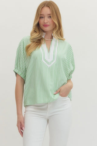 Striped short dolman sleeve top featuring contrast V-neck panel detail. Unlined. Woven. Non-sheer. Lightweight.