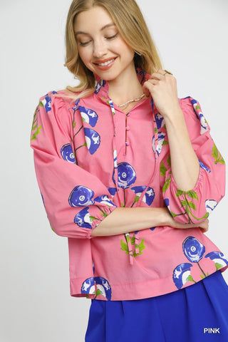 Pink Floral Blouse with 3/4 Puff Sleeve, Split Neckline with Tie Detail, and Large Blue Floral Pattern