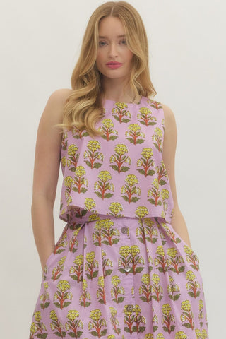 Floral print sleeveless top featuring high-low hem with straight neckline. Zipper at back. Unlined. Woven. Non-sheer. Lightweight.