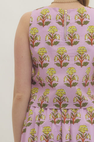 Floral print sleeveless top featuring high-low hem with straight neckline. Zipper at back. Unlined. Woven. Non-sheer. Lightweight.