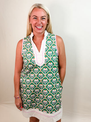 Sleeveless Mini Dress with Green Floral Pattern, V-Neck, Contrast Border Trim, and Pockets