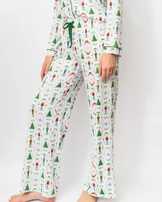 Christmas-themed nutcracker waltz pajama set with colorful patterns on a white background