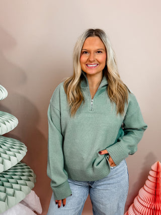 Mint green quarter zip sweater with lay down collar and relaxed fit