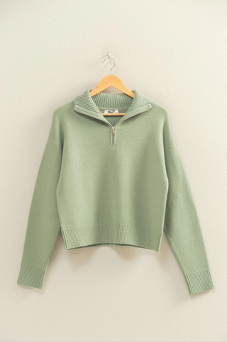 Mint green quarter zip sweater with lay down collar and relaxed fit