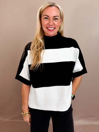 Thick striped Black and White knitted top with short sleeves and a boxy fit.