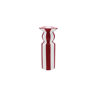 Red and white striped candle holder on a white background