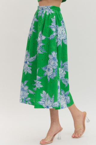Botanical print midi skirt featuring eyelet fabric. Elasticated back waistband. Side pockets. Lined. Woven. Non-sheer. Lightweight.