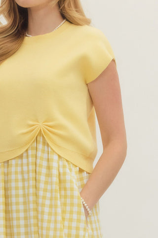 Solid knit short sleeve layered gingham midi dress set featuring removable pullover and scoop-neck sleeveless dress. Side pockets. Unlined. Woven. Non-sheer. Lightweight.