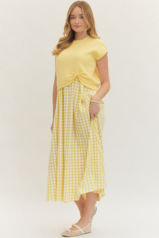 Solid knit short sleeve layered gingham midi dress set featuring removable pullover and scoop-neck sleeveless dress. Side pockets. Unlined. Woven. Non-sheer. Lightweight.