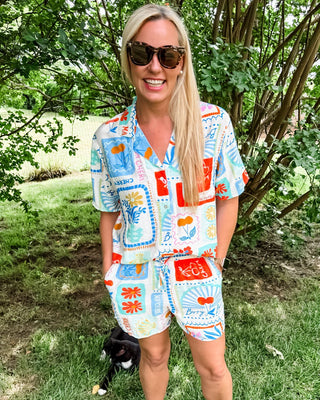Button up top and short set with colorful beachy summer print, lightweight material and vibrant color.