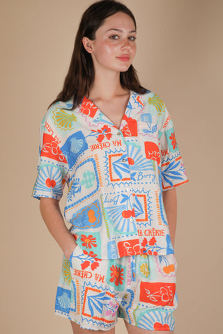 Button up top and short set with colorful beachy summer print, lightweight material and vibrant color.