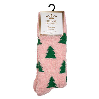 Pink fuzzy socks with green tree patterns on a white background.