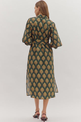 Botanical print half sleeve midi dress featuring self-tie belt at waist and button closure at front. Shirt collar. Buttoned cuffs. Lined. Woven. Non-sheer. Medium weight.