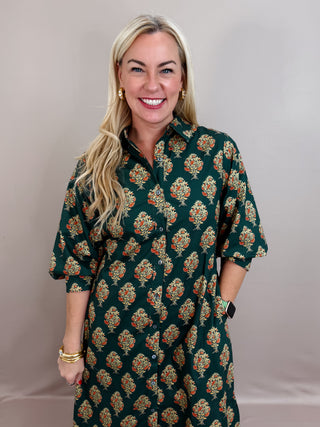 Botanical print half sleeve midi dress featuring self-tie belt at waist and button closure at front. Shirt collar. Buttoned cuffs. Lined. Woven. Non-sheer. Medium weight.