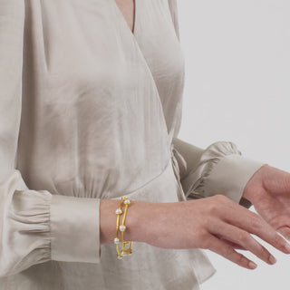 Julie Vos Milano Luxe Bangle with a lightly hammered bangle embellished with six iridescent gemstones.